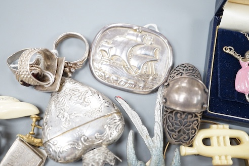 A 19th century 800 white metal heart shaped box, 63mm and a small grouop of other white metal items and costume jewellery.